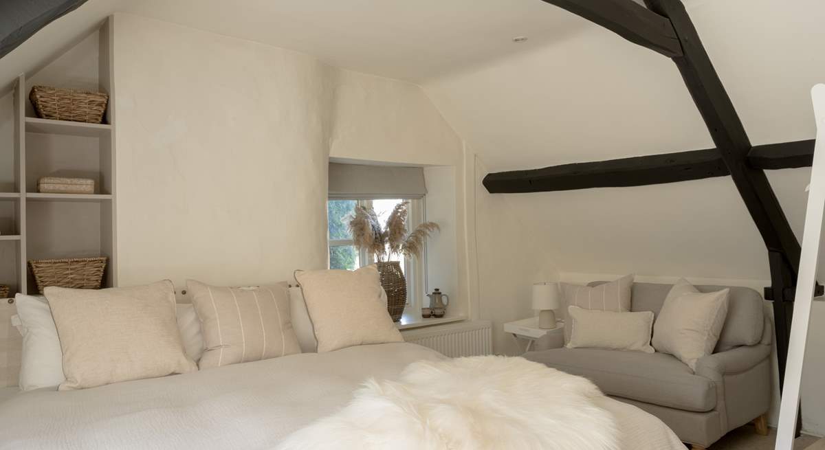 Curl up with a book in the large armchair. 