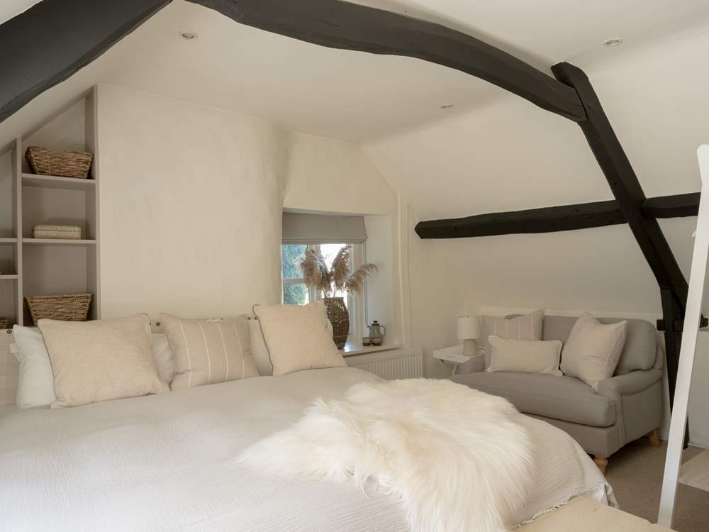 Curl up with a book in the large armchair.