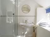 The en suite shower-room to bedroom 1 is a lovely light and sunny room.