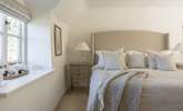Beautiful linens and squashy duvets add up to a soothing slumber. - Thumbnail Image