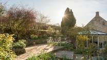 Sit on the terrace in the dappled sunlight. 