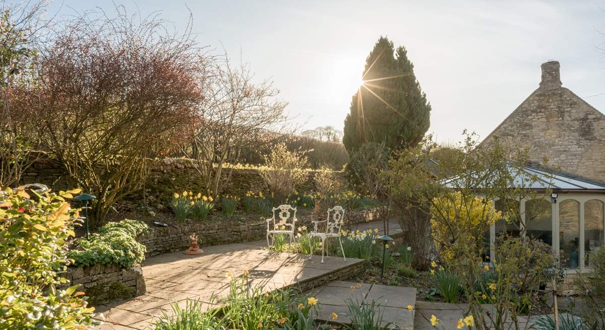 Sit on the terrace in the dappled sunlight. 