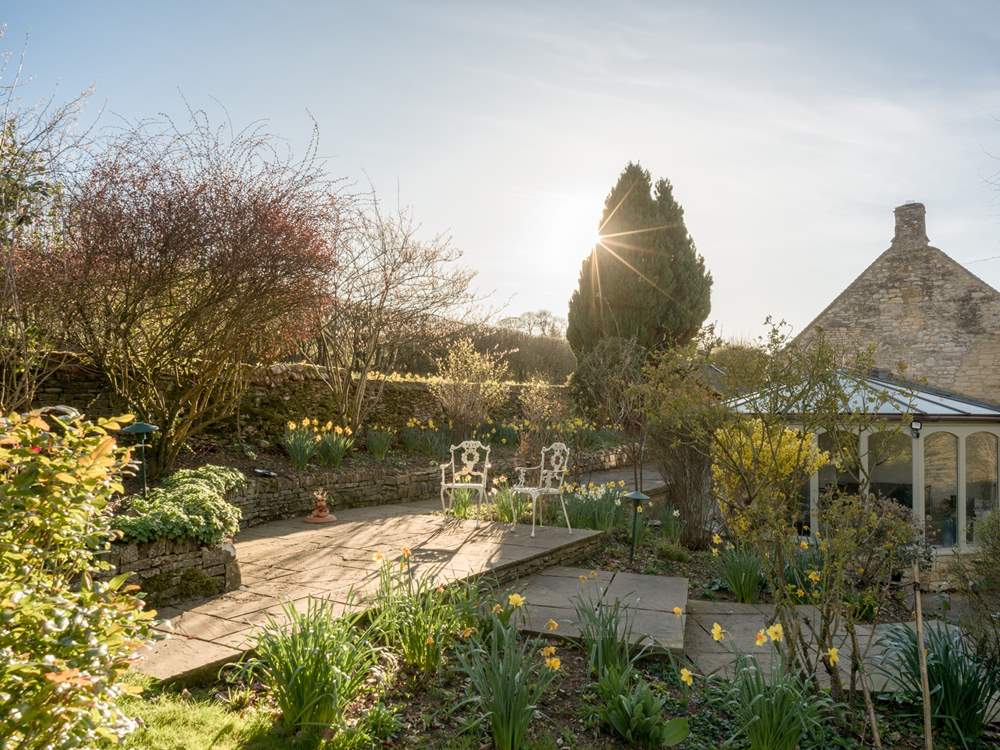 Sit on the terrace in the dappled sunlight.