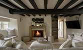 What could be more cosy and relaxing than a crackling fire and a squishy sofa.  - Thumbnail Image