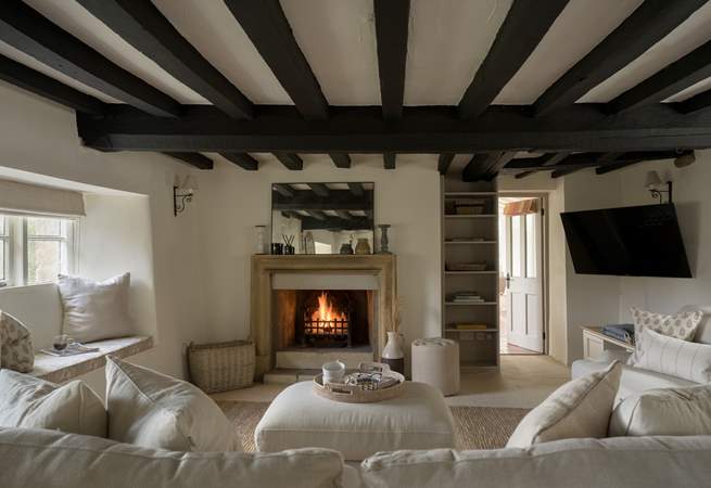 What could be more cosy and relaxing than a crackling fire and a squishy sofa. 