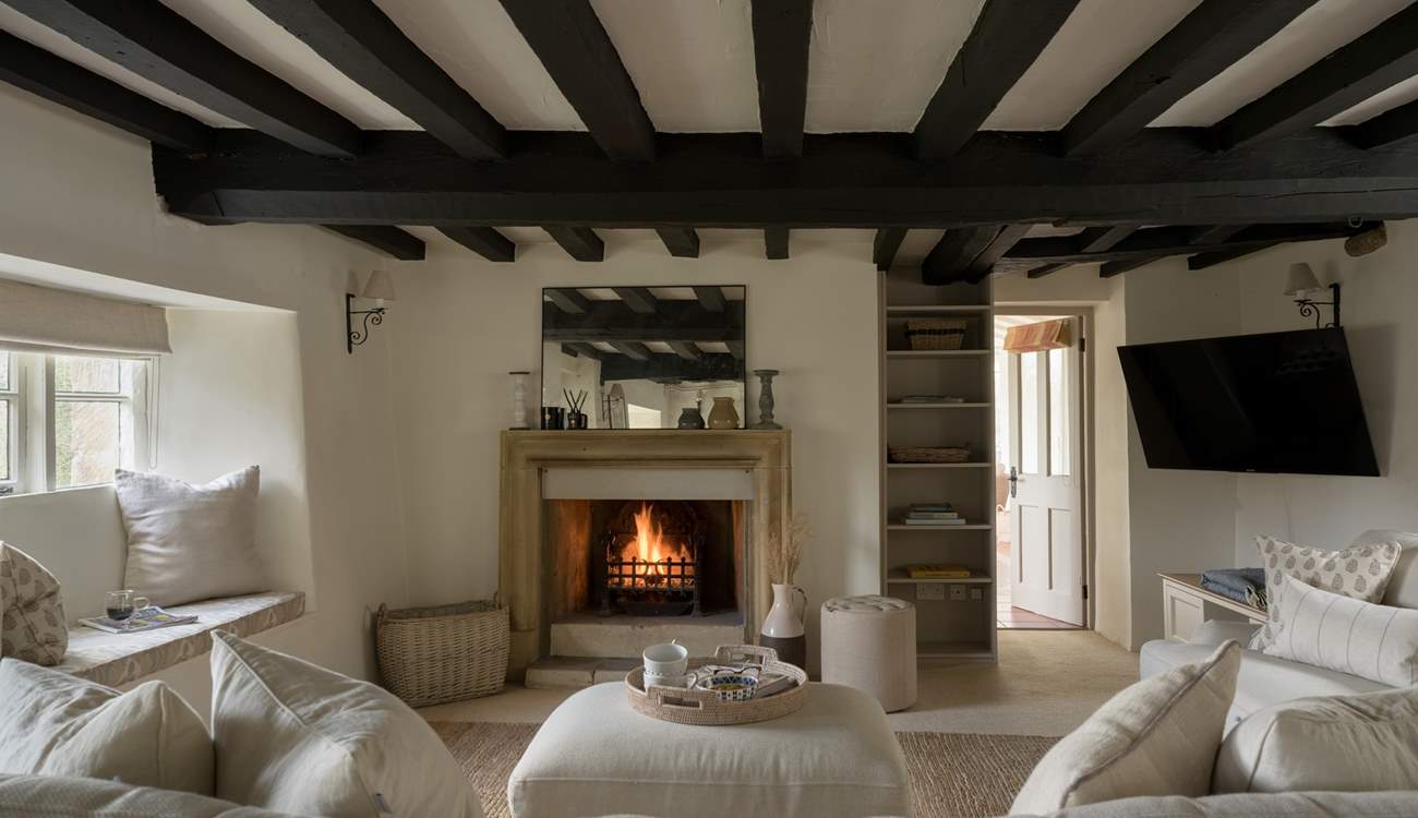 What could be more cosy and relaxing than a crackling fire and a squishy sofa. 
