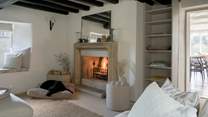 Who gets pride of place by the fire?