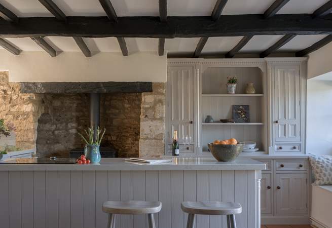 There is an ornamental wood-burner in the kitchen, just look at that inglenook fireplace. 
