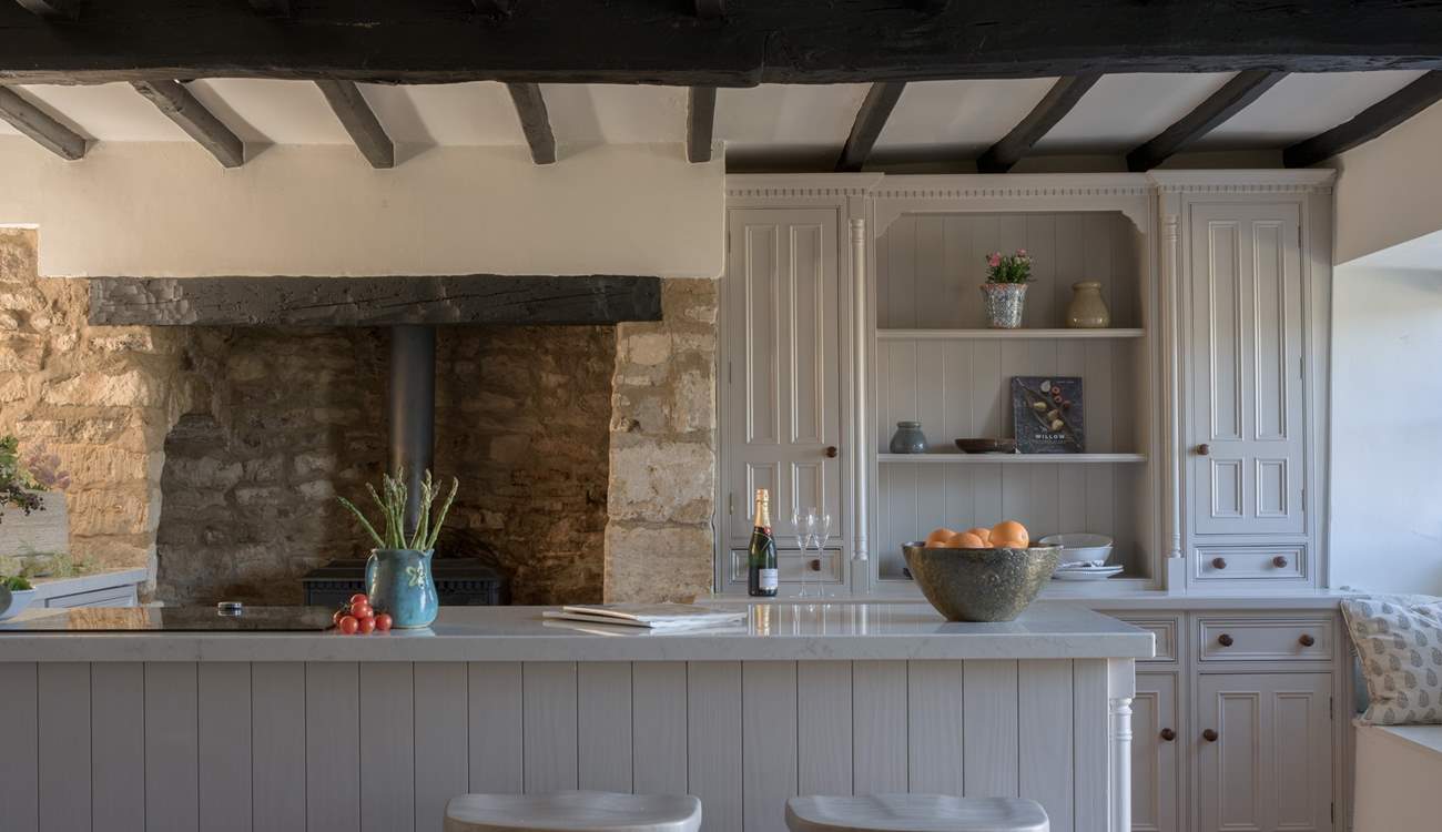 There is an ornamental wood-burner in the kitchen, just look at that inglenook fireplace. 