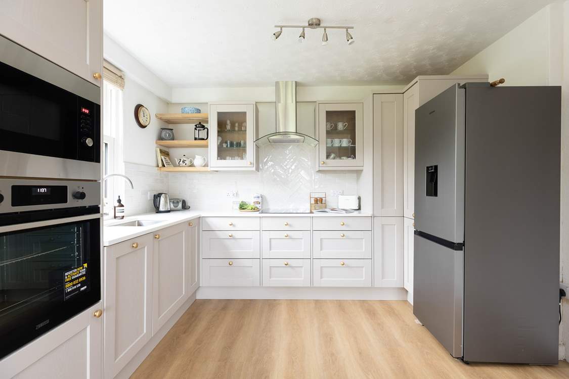The stylish farmhouse kitchen is well-equipped.