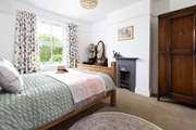 The main bedroom is so cosy with beautiful original features.