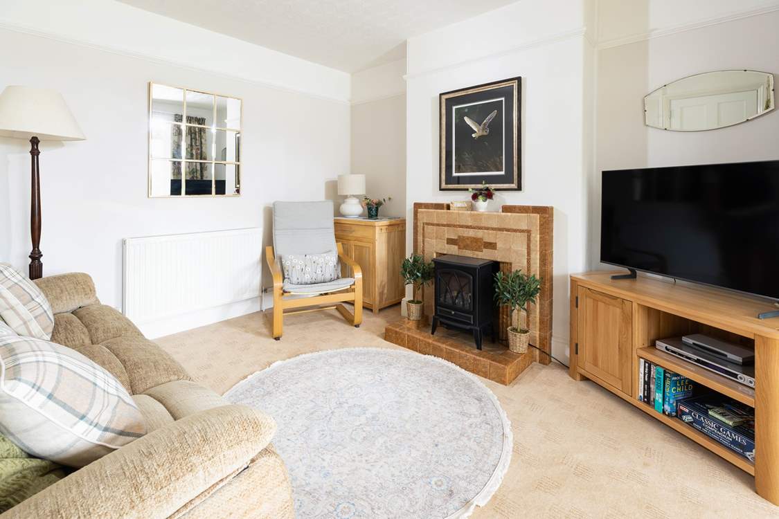 The sitting-room has a cosy electric wood-burner for snuggled up evenings together.