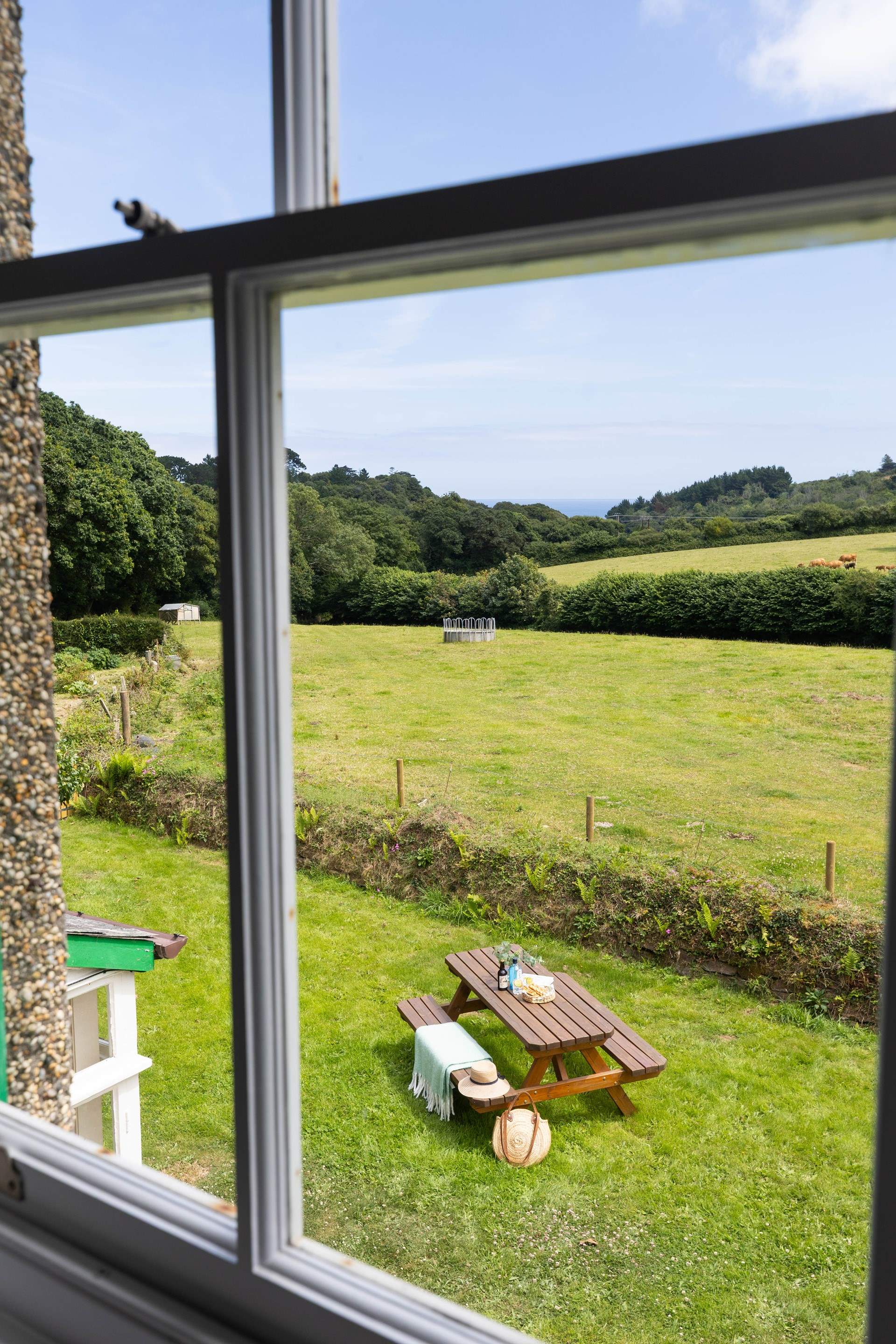 Over the fields all the way to the sea in the distance. 