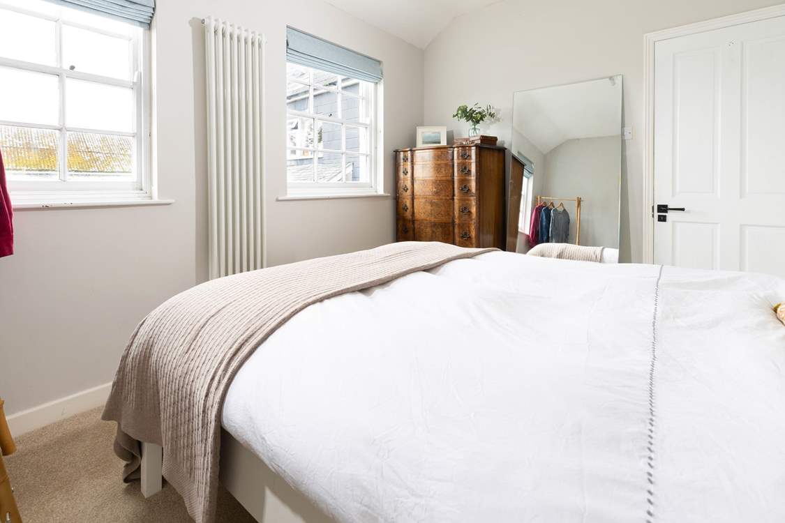 The double bedroom is at the back of the cottage overlooking the courtyard garden.