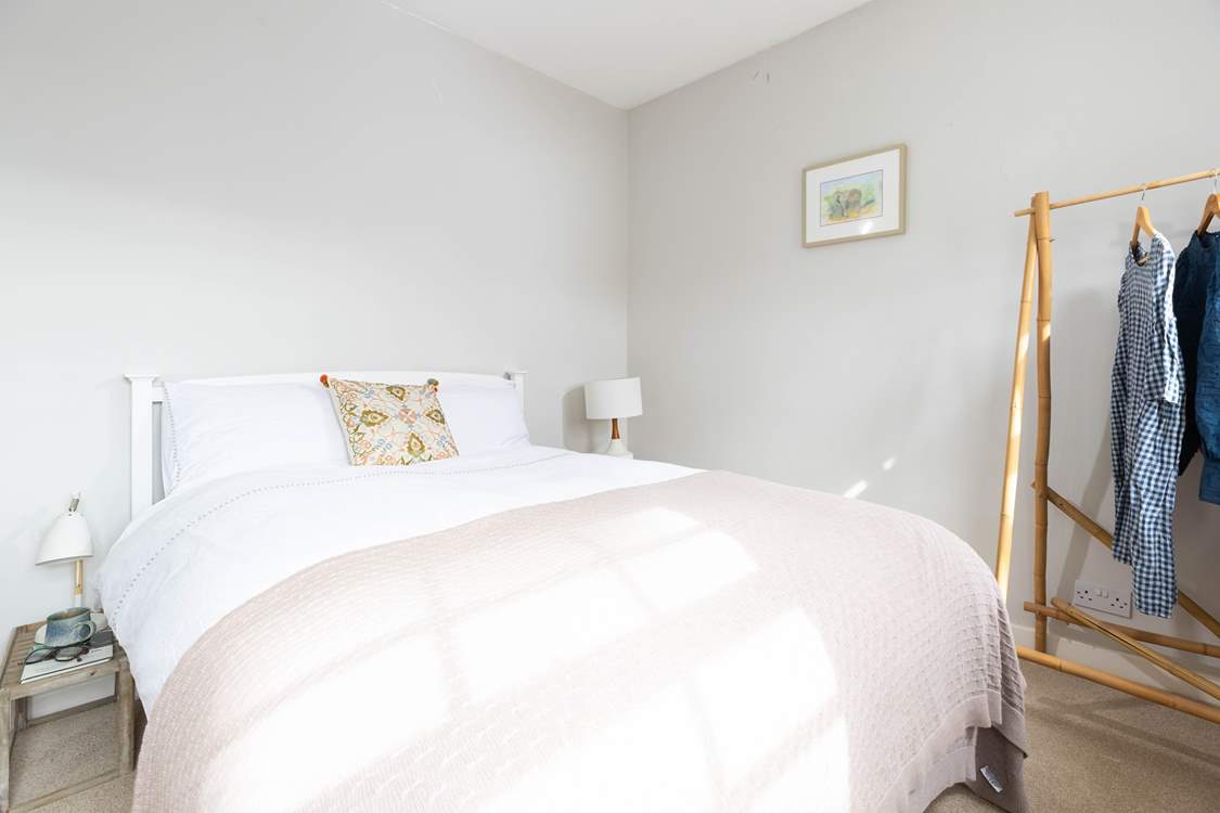 Morning light floods the bedroom.