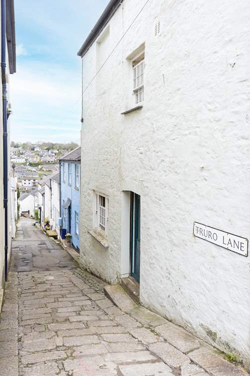 The narrow lane leads to Little Blue, suitable for medium-sized cars.