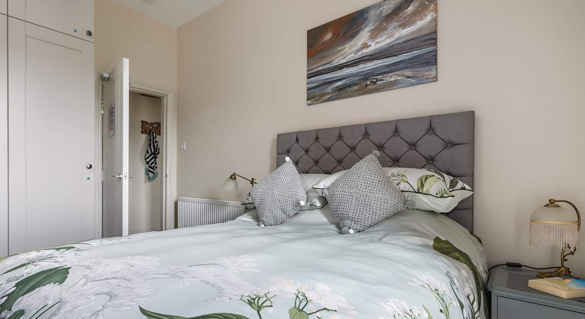 Relax and unwind in this light-filled space, which has ample storage for your holiday wardrobe.