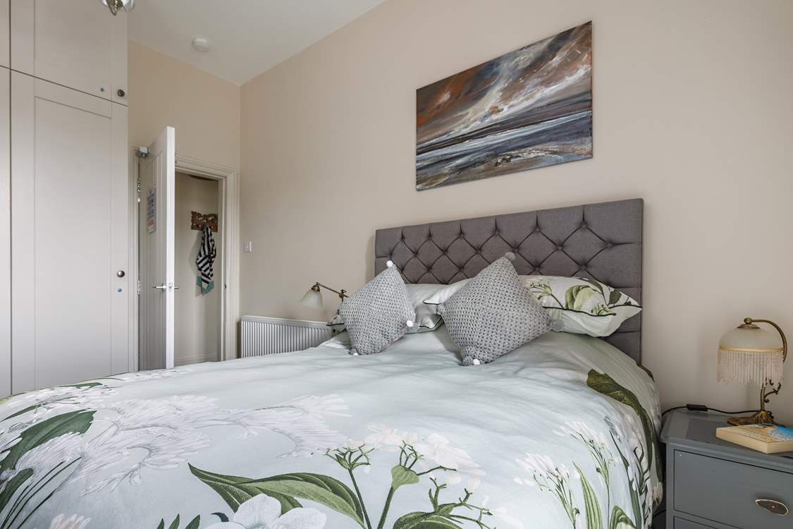 Relax and unwind in this light-filled space, which has ample storage for your holiday wardrobe.