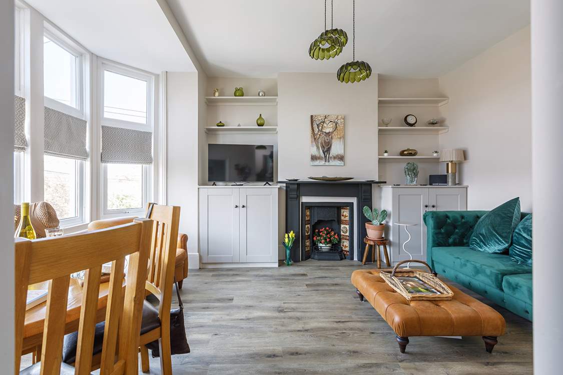 The light-filled living space has sumptuous seating.