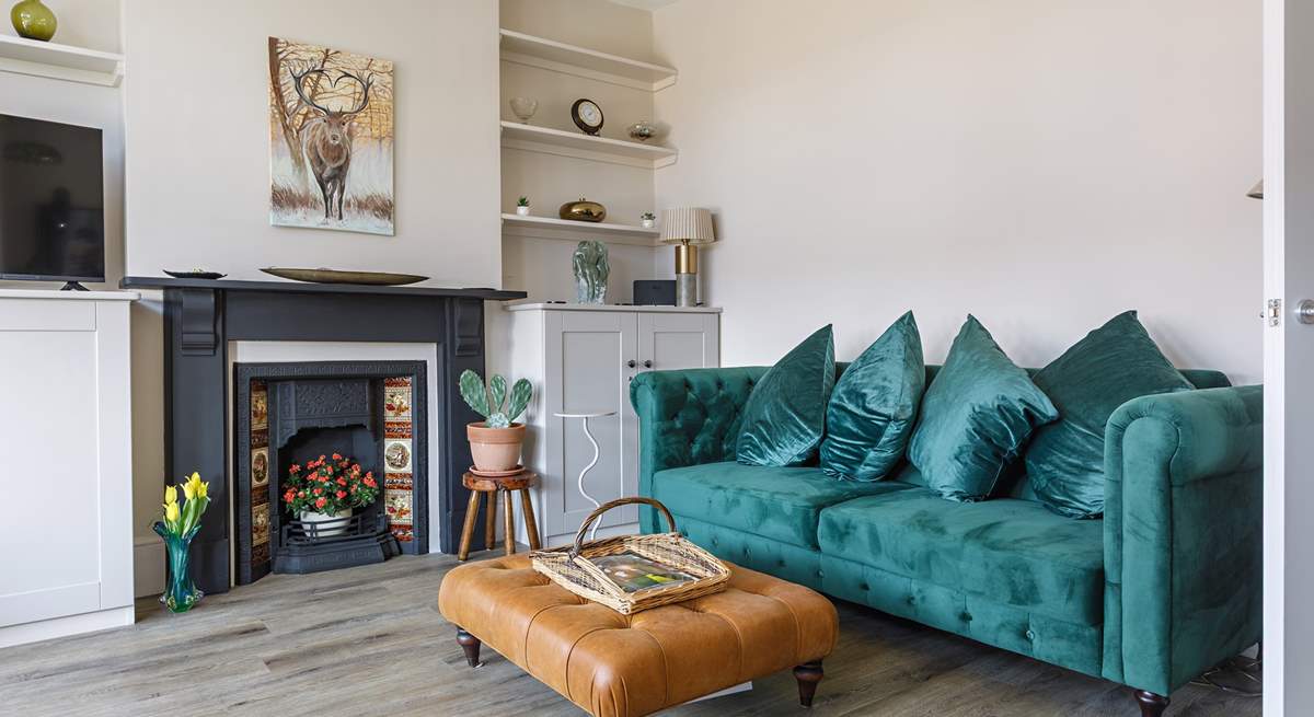 Relax with a novel on the luxury velvet sofa.