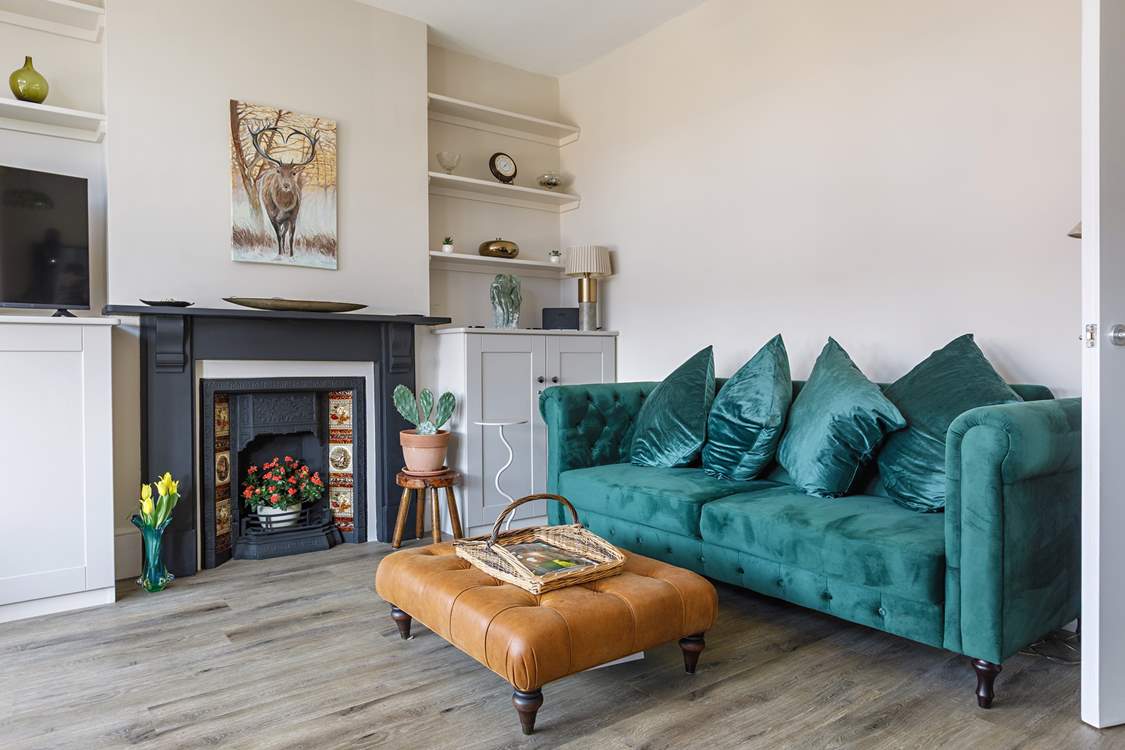 Relax with a novel on the luxury velvet sofa.