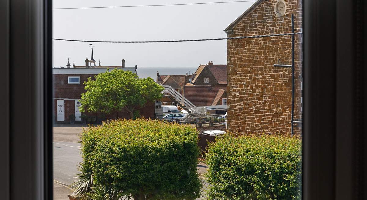 Enjoy sea glimpses from the bay window.