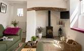 Beams and natural stone walls give a nod to the history of this gorgeous cottage.  - Thumbnail Image