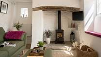 Beams and natural stone walls give a nod to the history of this gorgeous cottage. 