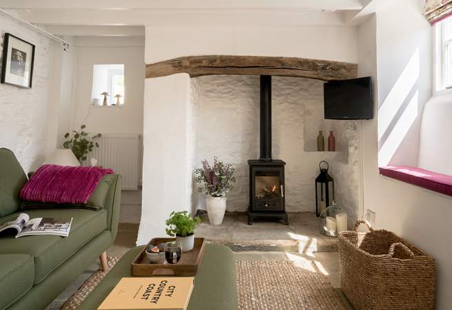 Beams and natural stone walls give a nod to the history of this gorgeous cottage. 