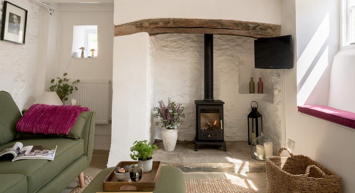 Beams and natural stone walls give a nod to the history of this gorgeous cottage. 