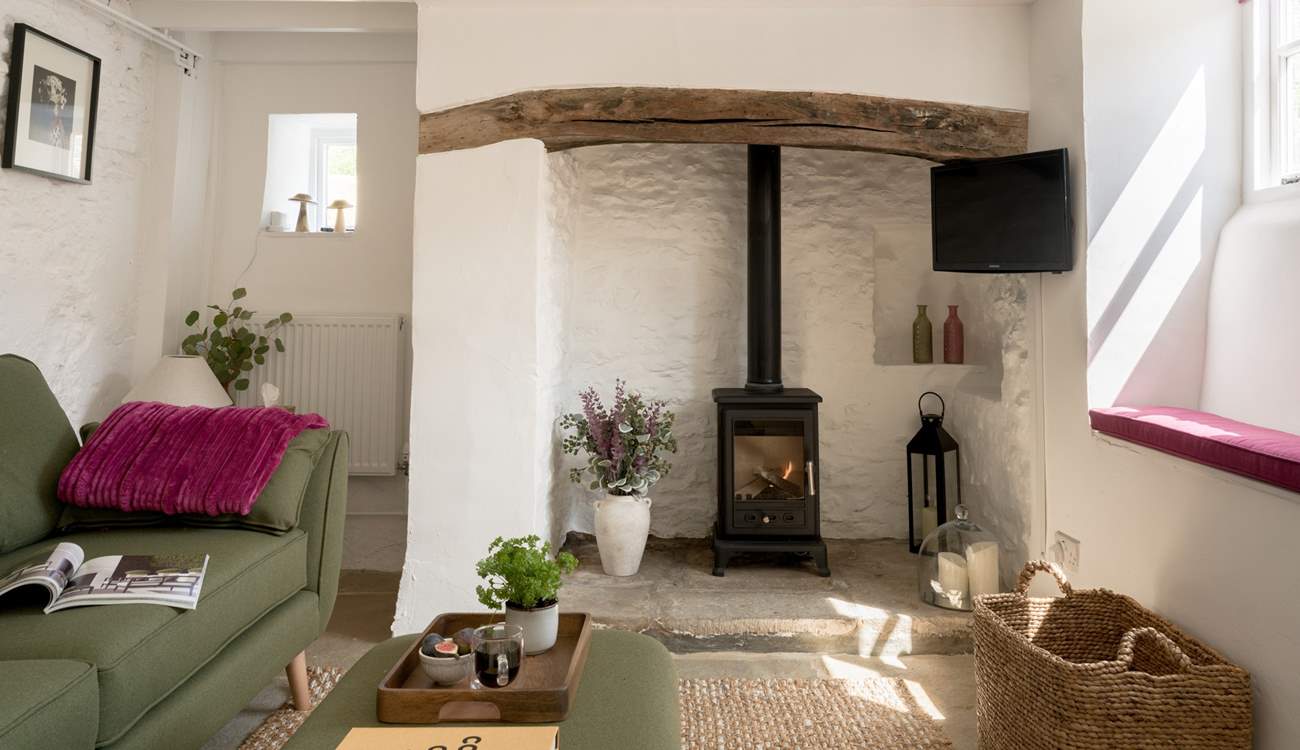 Beams and natural stone walls give a nod to the history of this gorgeous cottage. 