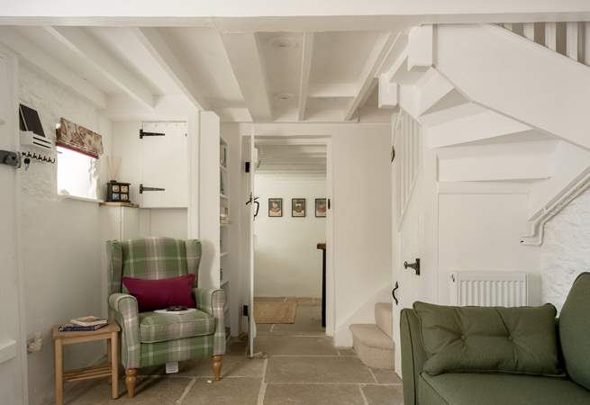 The staircase is narrow and winds to the first floor. 