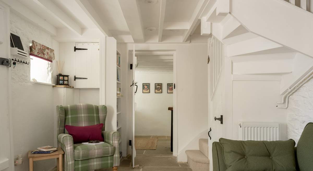 The staircase is narrow and winds to the first floor. 