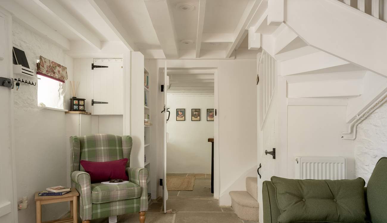 The staircase is narrow and winds to the first floor. 