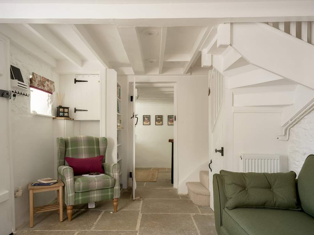 The staircase is narrow and winds to the first floor.