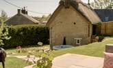 Sit in the sun on the raised patio and relax.  - Thumbnail Image