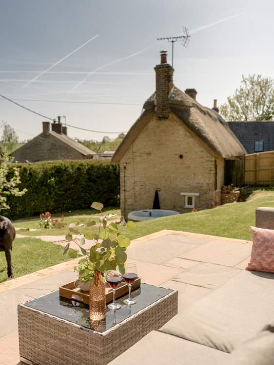 Sit in the sun on the raised patio and relax.