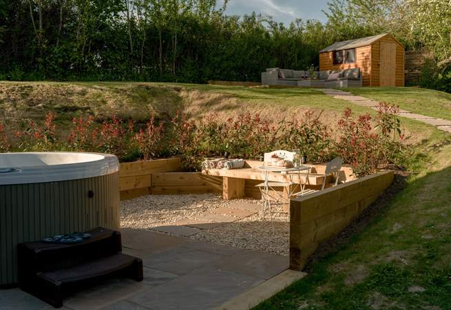 Enjoy an al fresco snack by the hot tub. 
