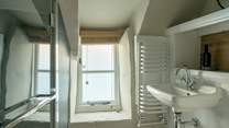 The chic shower-room has been cleverly designed to accommodate the history of the building. 