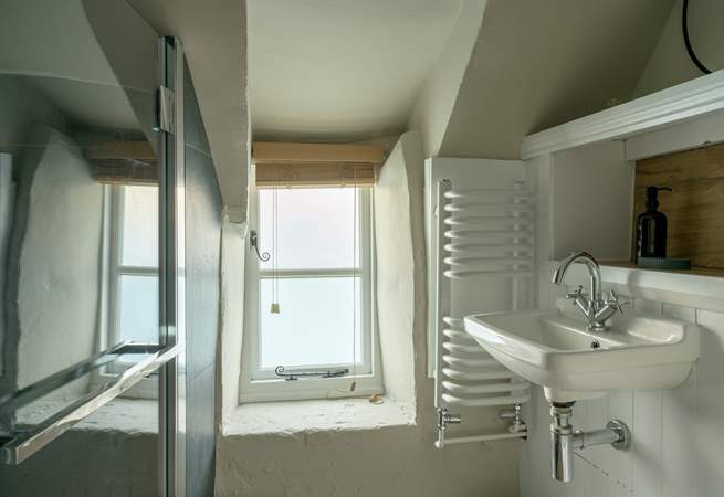 The chic shower-room has been cleverly designed to accommodate the history of the building. 
