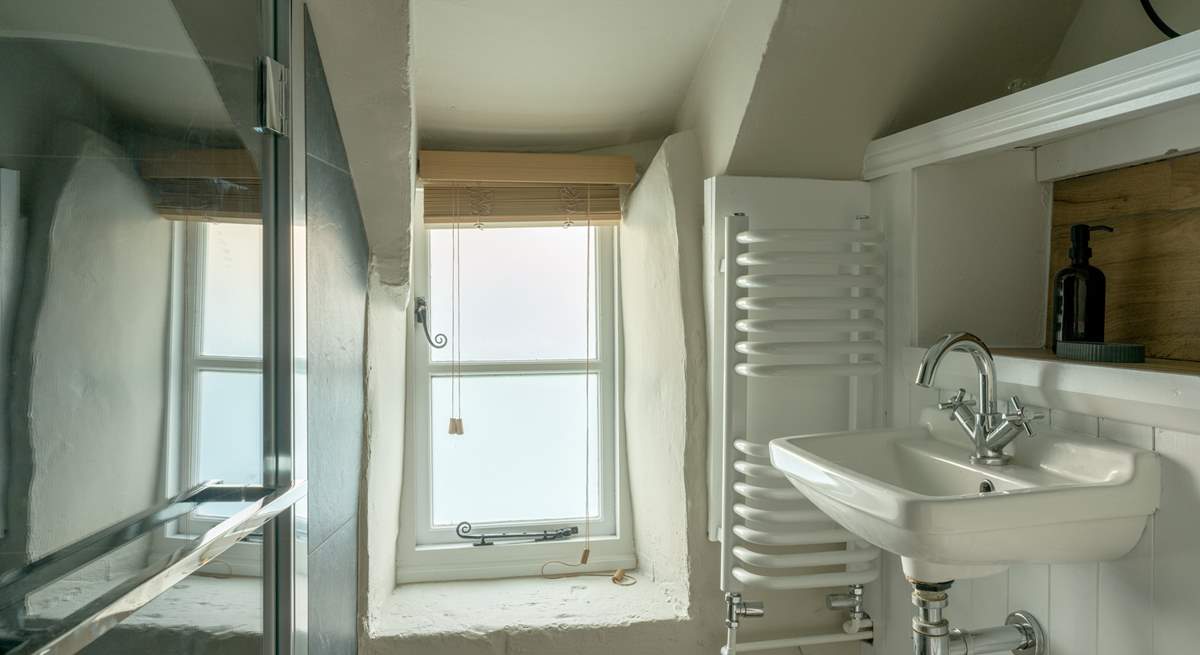 The chic shower-room has been cleverly designed to accommodate the history of the building. 