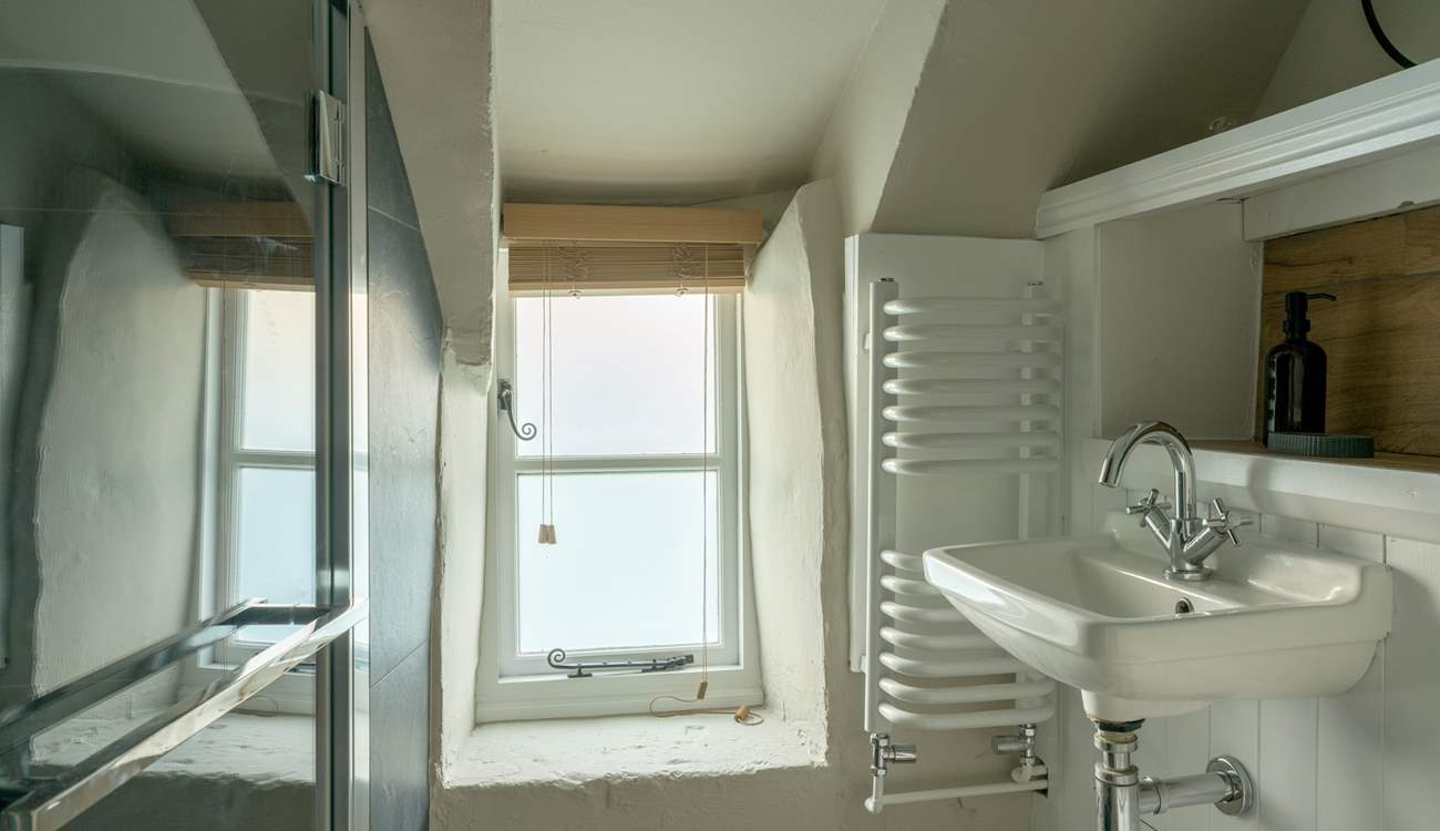 The chic shower-room has been cleverly designed to accommodate the history of the building. 