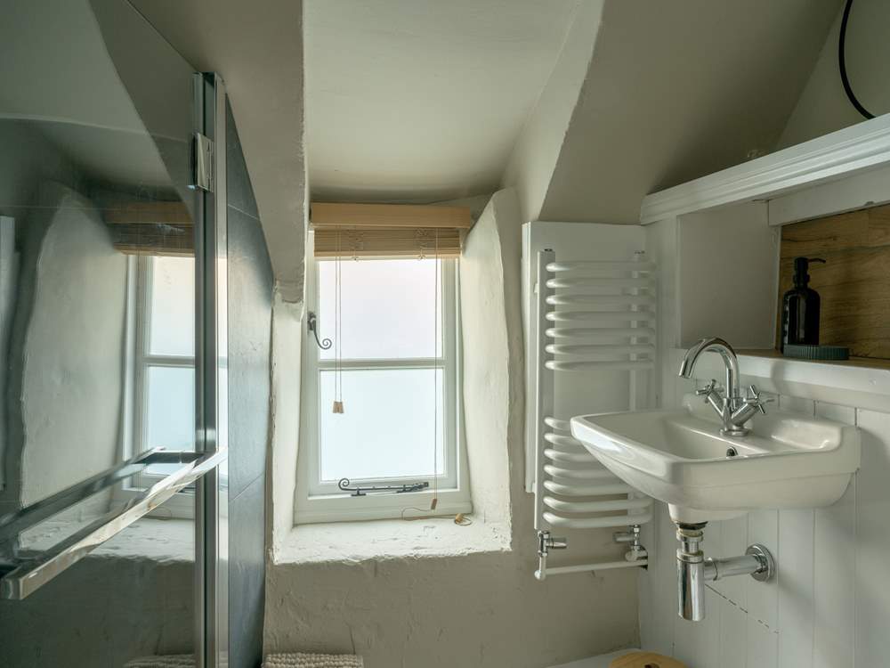 The chic shower-room has been cleverly designed to accommodate the history of the building.