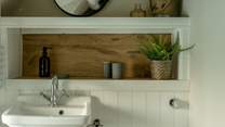 The shower-room has lovely original beams. 