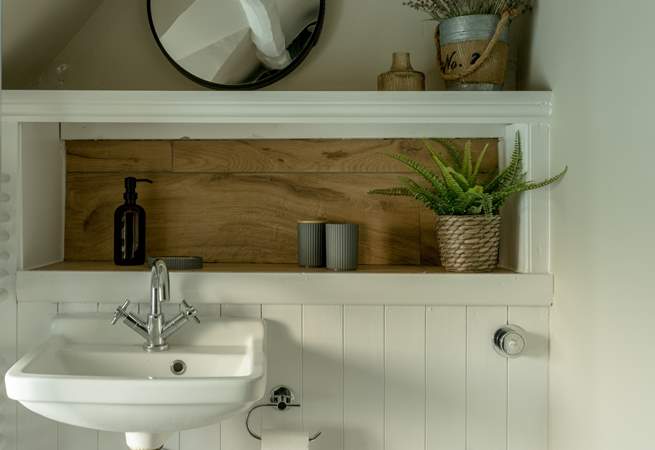 The shower-room has lovely original beams. 