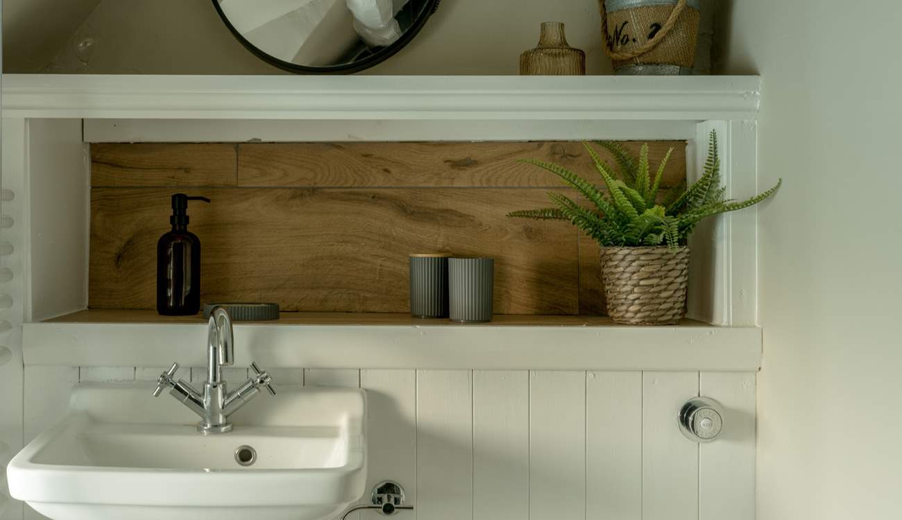 The shower-room has lovely original beams. 