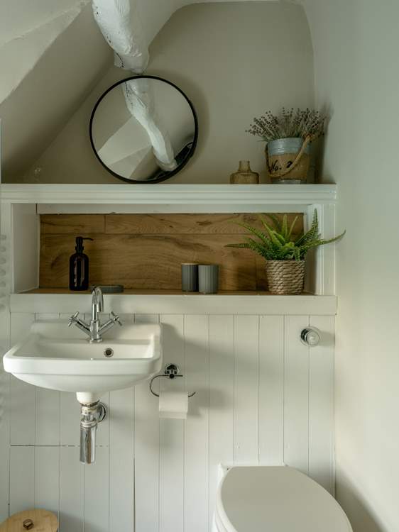 The shower room has lovely original beams.