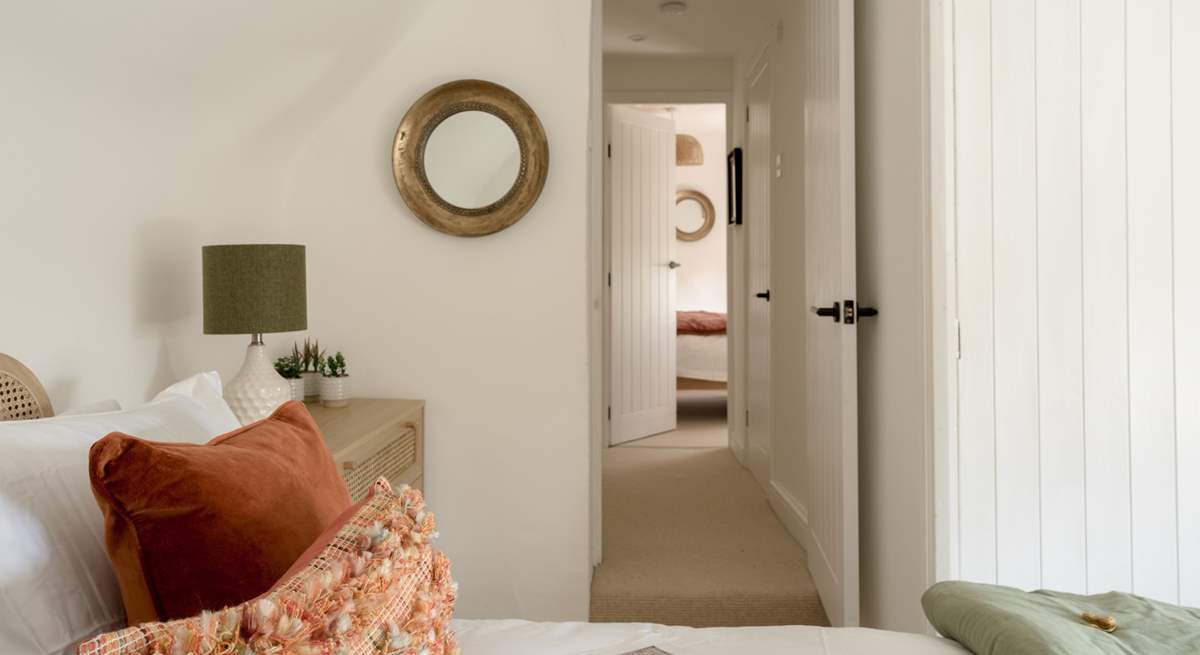 This double bedroom is decorated in relaxing shades. 