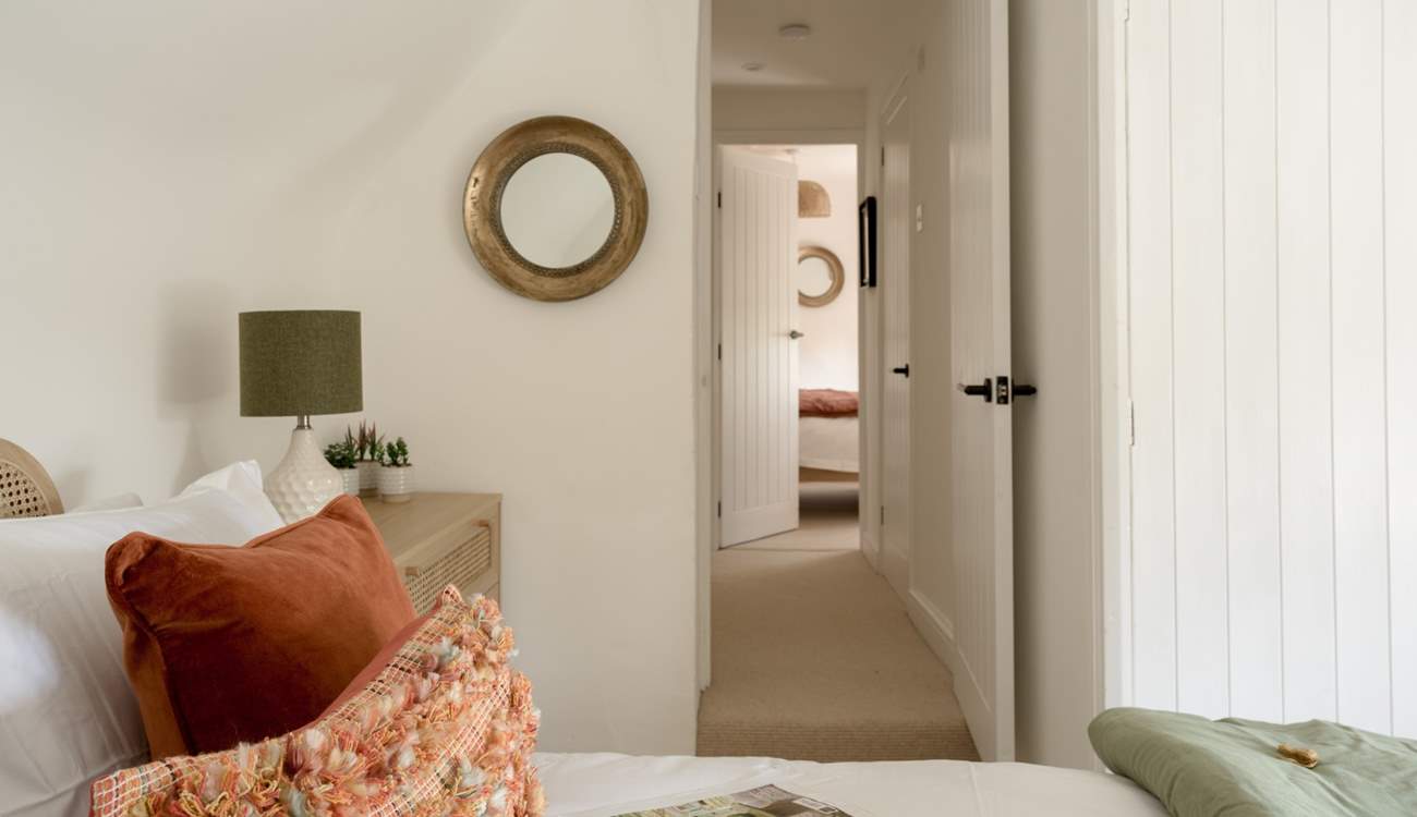 This double bedroom is decorated in relaxing shades. 