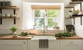 The kitchen window looks out over the front garden and the verdant hedge.  - Thumbnail Image